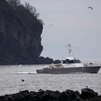 不明12人の捜索続く、知床沖 画像